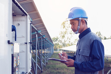 engineer or electrician working on checking and inspect equipment with checklist at outdoor industry 