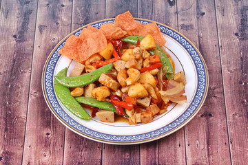 Fried mixed fruit and vegetable with roasted chili plate .