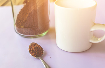 Coffee cup and beans on a white background.