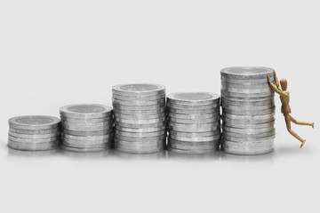 Wooden dummy climbing up to stand on the medal.