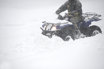 man removing snow driving snowplow