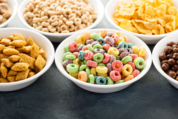 Variety of cold cereals in white bowls
