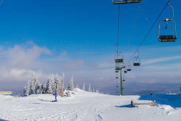Fototapeta na wymiar Ski lift and chairs