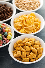 Variety of cold cereals in white bowls