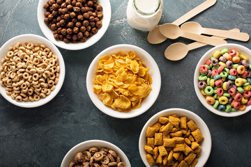 Variety of cold cereals in white bowls