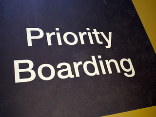 Priority boarding mat sign in an international airport