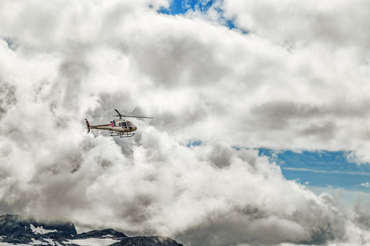 Views Of The Mountain Sightseeing Tour Helicopter In Sky Over Norwegian Mountains Near Trolltunga Sign Landmark, Hardangervidda National Park, Norway.