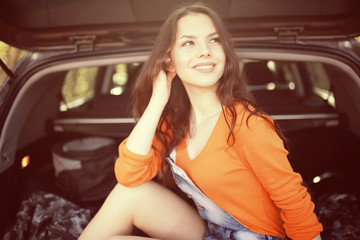 Fototapeta na wymiar young beautiful girl in the car autumn trip