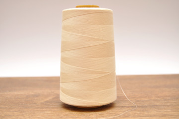 A skein of white thread on the table