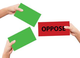 hand hold a placard presenting phrase of oppose