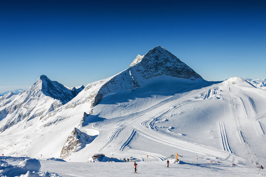 Sunny view of Austrian Alps from viewpoint of ski resort Zillertal Hintertuxer Glacier, Tirol, Austria.