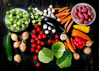 Gordijnen Organic vegetables on dark wooden table. © bit24