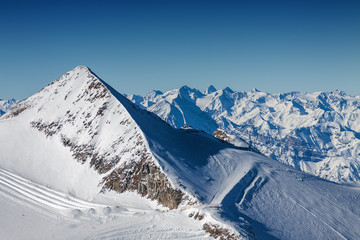 Sunny view of Austrian Alps from viewpoint of ski resort Zillertal Hintertuxer Glacier, Tirol, Austria.