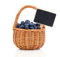 Bilberry in a basket to the board for text, on a white backgroun
