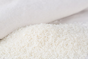 Rice grains closeup on a white background.