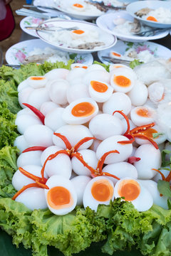 boiled eggs cut in half with chilli put on for serve