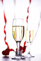 glass of white wine on a table on white background isolate