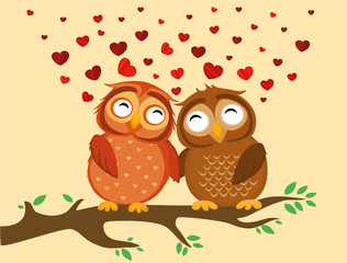 A pair of cute owlet sitting on a branch. Owls in love hearts 
