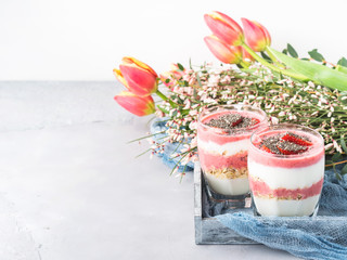 Yogurt strawberry fruit parfait festive romantic breakfast dessert with rolled oats and chia seeds...