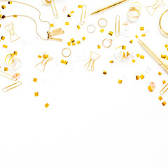 Naklejka premium Beauty blog background. Gold style feminine accessories. Golden tinsel, scissors, pen, rings, necklace, bracelet on white background. Flat lay, top view.