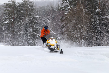 Athlete on a snowmobile