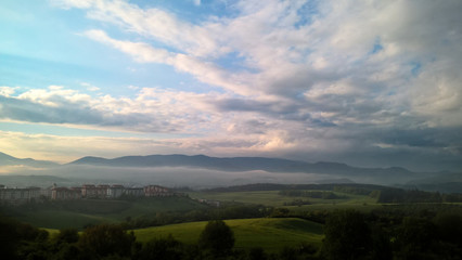 Misty morning with view on the fog on meadow. Slovakia