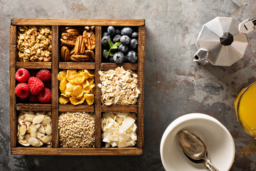 Breakfast foods in a wooden box overhead shot