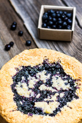 Homemade Blueberry Cake on Wooden Background with Blueberries on Paper Box