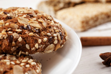 Fototapeta na wymiar Close-up shot of homemade oatmeal cookies in a white ceramic plate