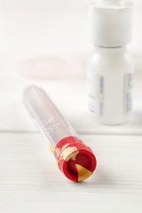 Container for medical tests close-up shot, vertical