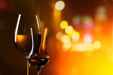  glasses with drinks on a background of night city