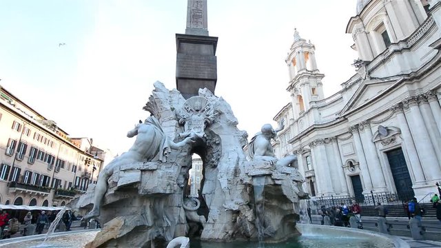 Fountain of the Four Rivers in Piazza Navona and St. Agnes Church in Agone. Rome, Italy
