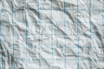 Wrinkled squared paper texture closeup shot, macro