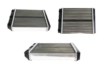 Many engine cooling radiators isolated on white background. Auto spare parts for passenger car.