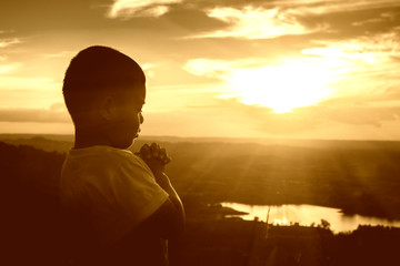 Boy praying on the Mount, thank God.