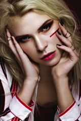 Obraz premium Beautiful girl with art make up in white striped shirt. beauty face. Photos shot in studio