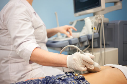 Ultrasound machine doctor"s hand usg investigation USCG