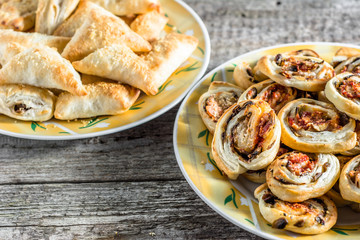 Fresh baked puff pastry snack with filling on a plate