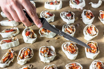 Sliced dough with filling, preparing puff pastry buns, cooking concept