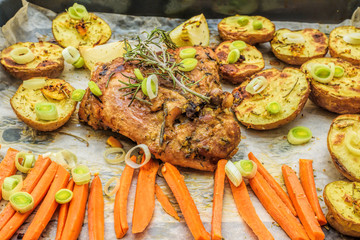 Roasted garlic and lemon turkey with vegetables and rosemary. Homemade dinner