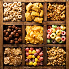 Variety of cold cereals in a wooden box overhead