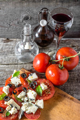Vegetarian salad with tomatoes and feta, greek cuisine, mediterranean food