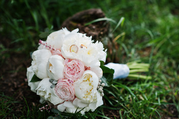 Elegance wedding bouquet of white and rose peonies with wedding