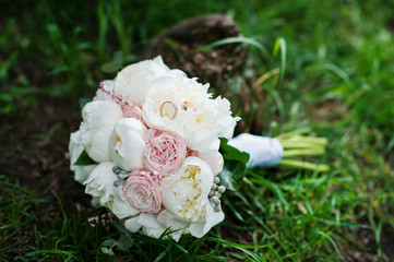 Obraz na płótnie Canvas Elegance wedding bouquet of white and rose peonies with wedding