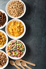 Variety of cold cereals in white bowls