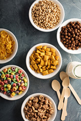Variety of cold cereals in white bowls