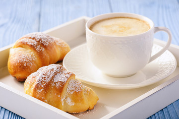 Homemade sweet croissants stuffed with cheese.