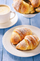 Homemade sweet croissants stuffed with cheese.