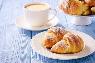 Homemade sweet croissants stuffed with cheese.