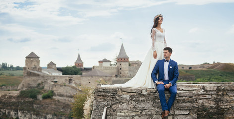 Fototapeta premium Couple in love near castle
